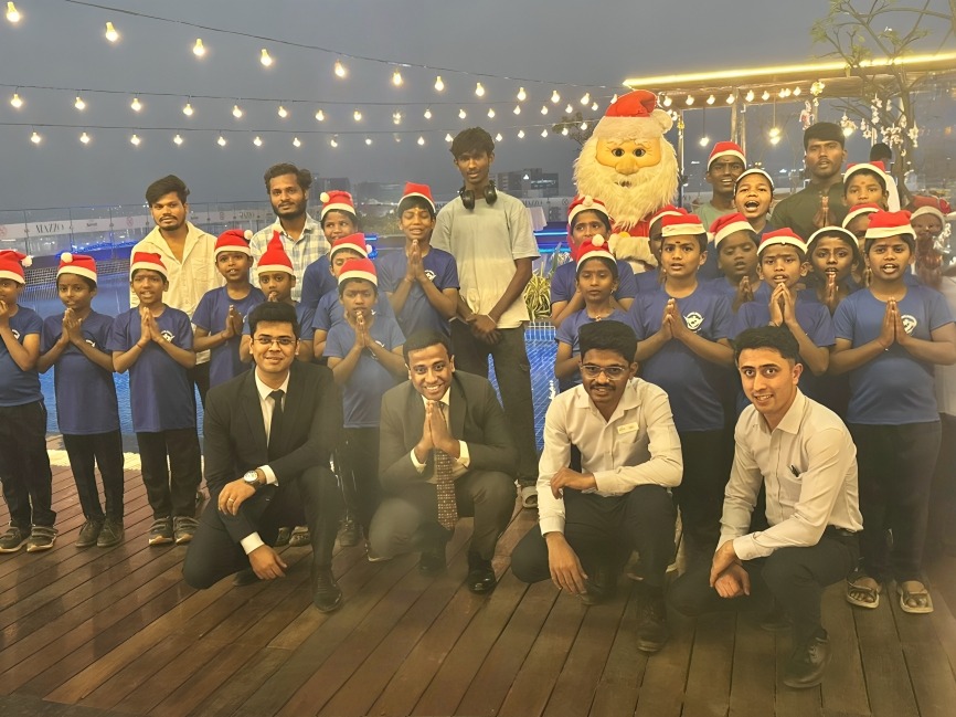 Children from Aashri Society NGO join General Manager Ashwin Vaidya and the Marriott Executive Apartments Hyderabad team for the ceremonial Christmas tree lighting.